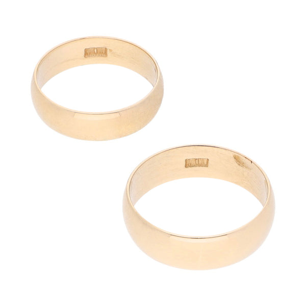 Dos argollas lisas en oro amarillo 14 kilates.