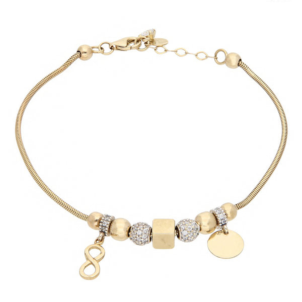 Pulsera eslabón cola de ratón con aplicaciones y sinteticos en oro dos tonos 14 kilates.