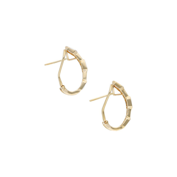 Aretes diseño especial platinados con diamantes en oro amarillo 14 kilates.