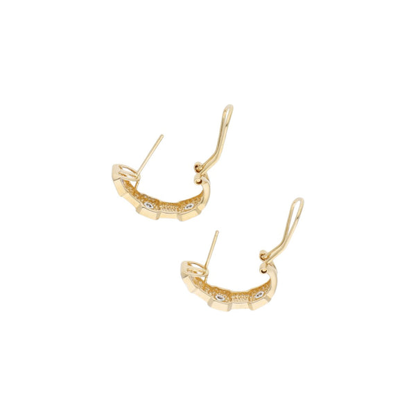 Aretes diseño especial platinados con diamantes en oro amarillo 14 kilates.