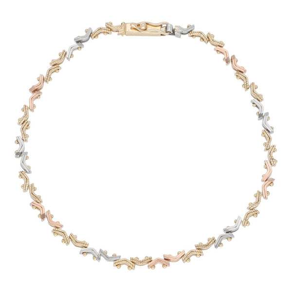 Pulsera eslabón articulado en oro tres tonos 14 kilates.