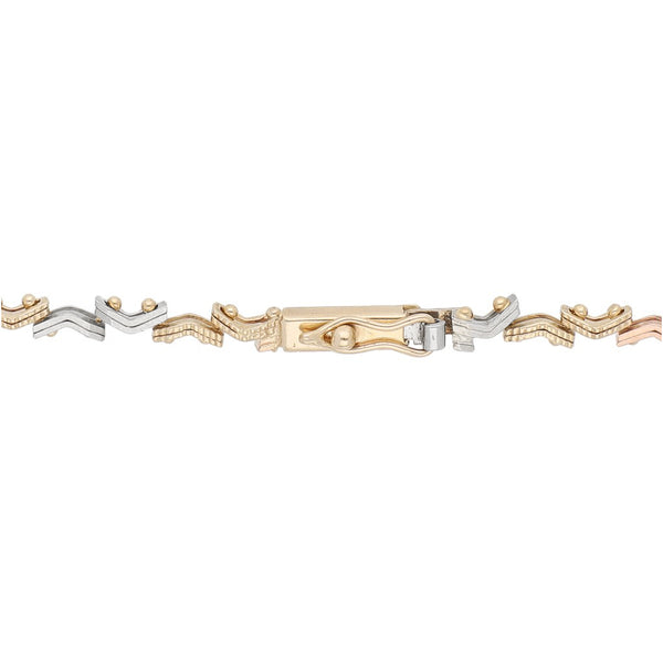 Pulsera eslabón articulado en oro tres tonos 14 kilates.