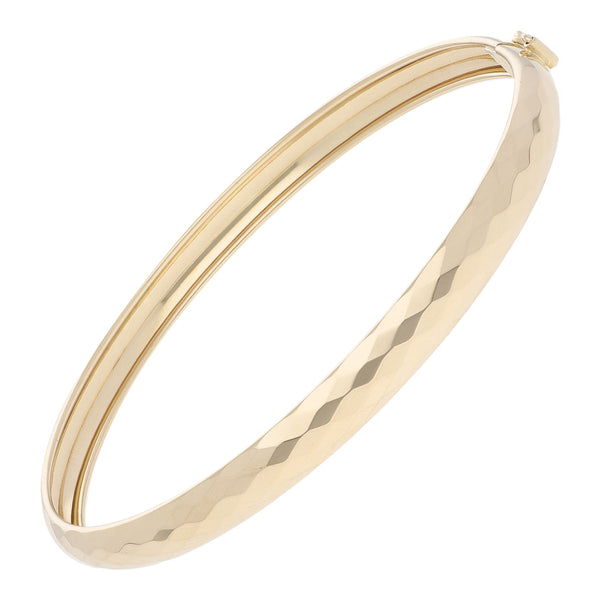 Pulsera de arillo facetada en oro amarillo 14 kilates.