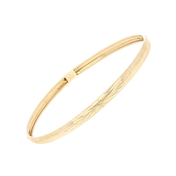 Pulsera de arillo labrada en oro amarillo 14 kilates.