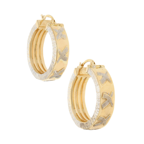 Arracadas huecas platinadas en oro amarillo 14 kilates.