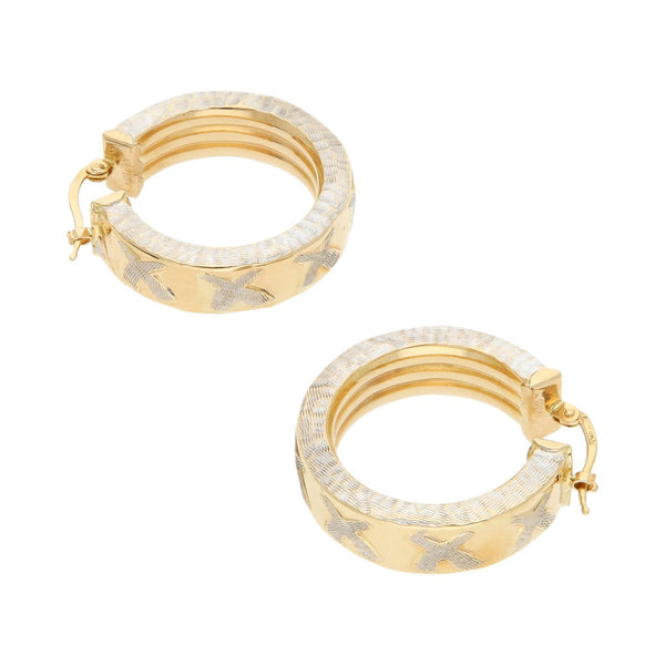 Arracadas huecas platinadas en oro amarillo 14 kilates.