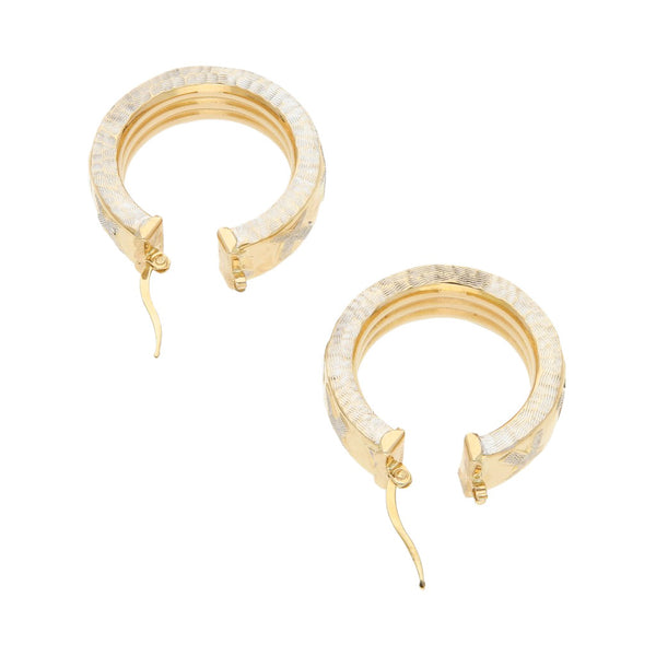 Arracadas huecas platinadas en oro amarillo 14 kilates.