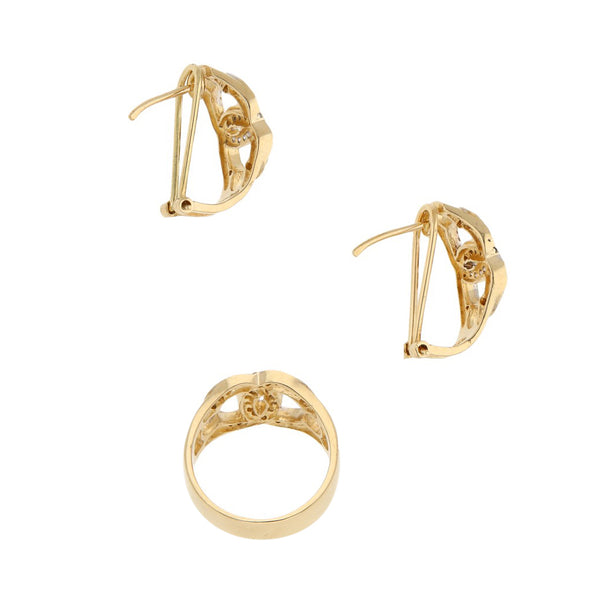 Juego de anillo y aretes diseño especial con circonias en oro amarillo 14 kilates.