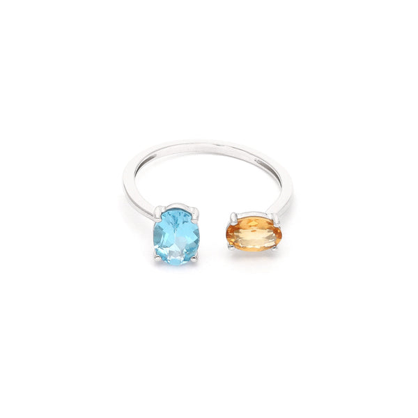 Anillo abierto con topacio y citrina en oro blanco 14 kilates.