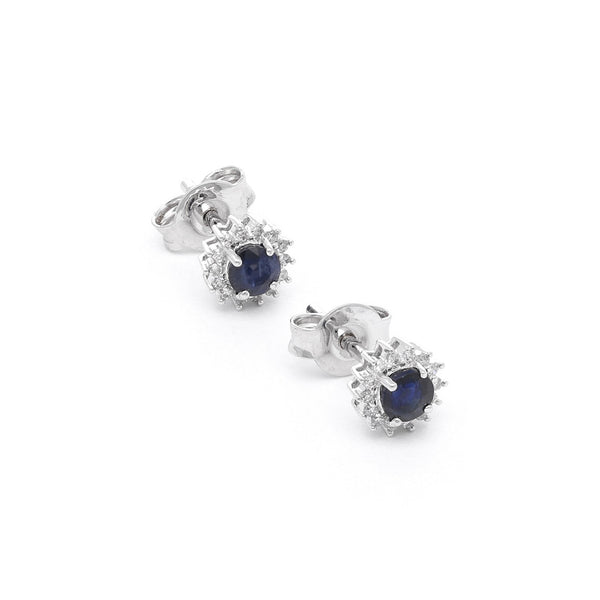 Aretes diseño especial con diamantes y zafiro en oro blanco 14 kilates.