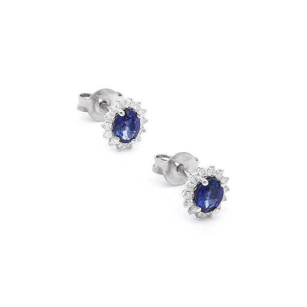Aretes diseño especial con diamantes y zafiros en oro blanco 14 kilates.