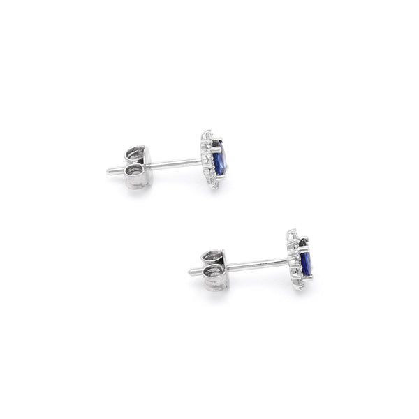 Aretes diseño especial con diamantes y zafiros en oro blanco 14 kilates.