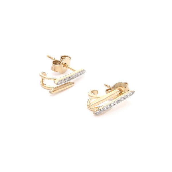 Aretes estilizados con diamantes en oro amarillo 14 kilates.