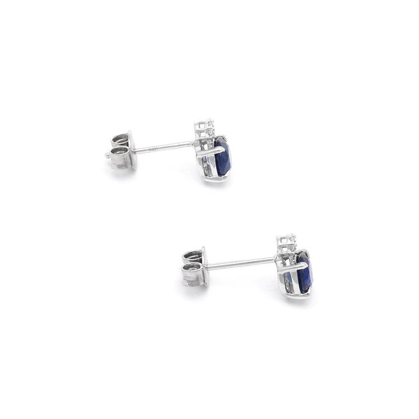 Aretes diseño especial con diamantes y zafiros en oro blanco 14 kilates.