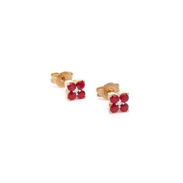 Aretes diseño especial con diamantes y rubíes en oro amarillo 14 kilates.