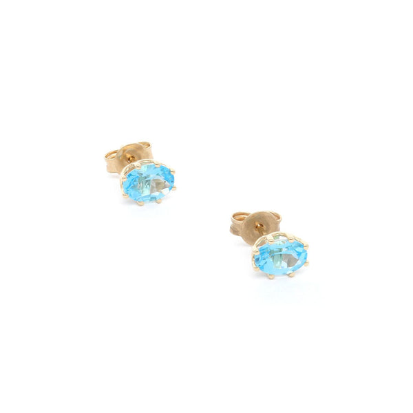 Aretes diseño especial con topacios en oro amarillo 14 kilates.