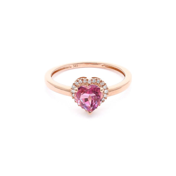 Anillo diseño especial motivo corazón con diamantes y topacio en oro rosa 14 kilates.
