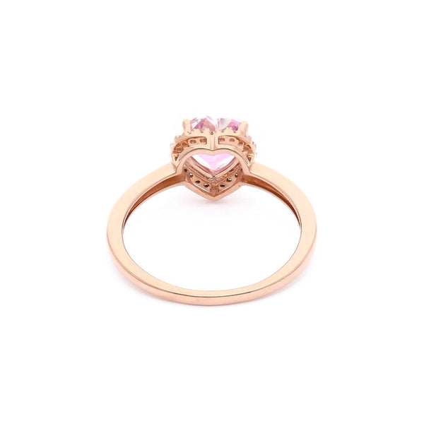 Anillo diseño especial motivo corazón con diamantes y topacio en oro rosa 14 kilates.