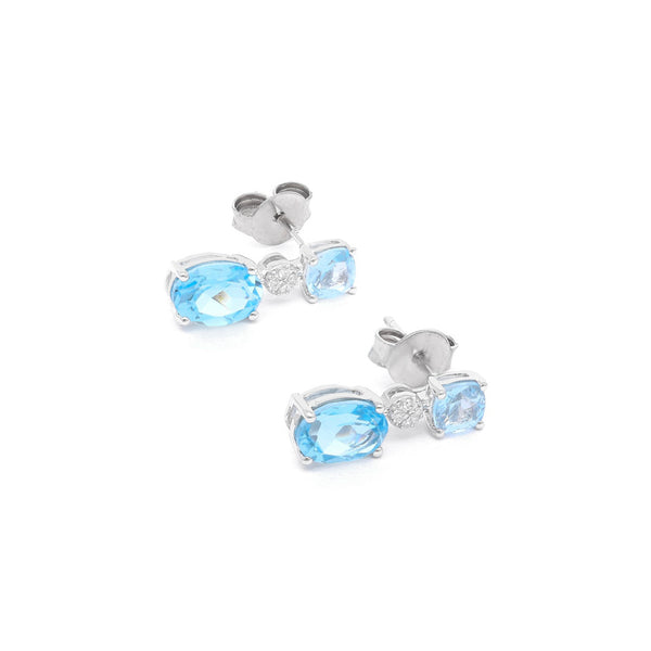Aretes diseño especial con diamantes y topacios en oro blanco 14 kilates.