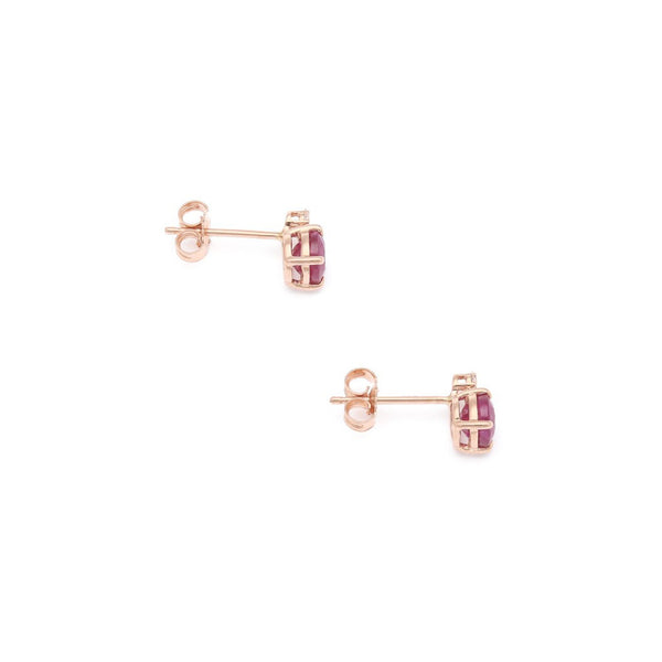 Aretes diseño especial con diamantes y rubíes en oro rosa 14 kilates.