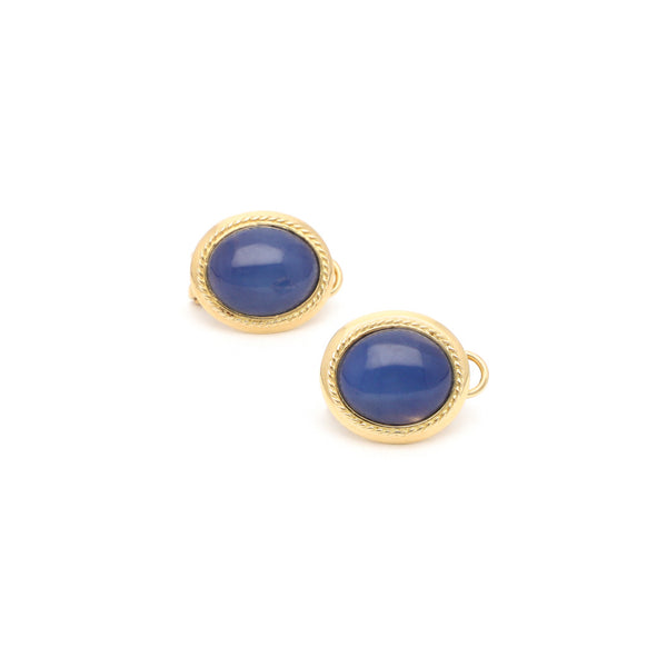 Aretes diseño especial con zafiro estrella en oro amarillo 14 kilates.