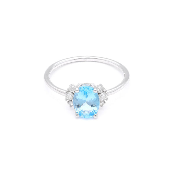 Anillo diseño especial con diamantes y topacio en oro blanco 14 kilates.