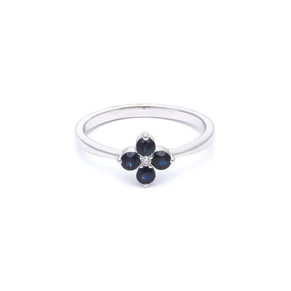Anillo diseño especial con diamantes y zafiro en oro blanco 14 kilates.