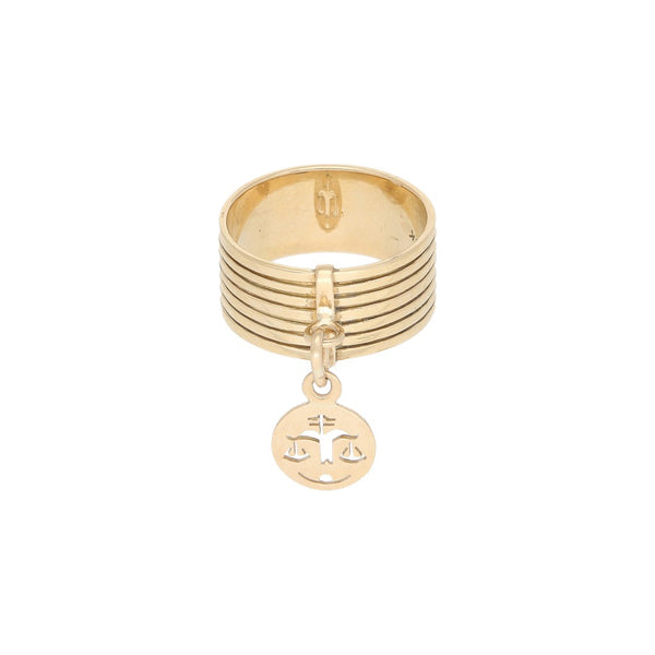 Anillo diseño especial con colgante motivo libra en oro amarillo 12 kilates.