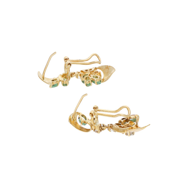 Aretes estilizados con sintéticos en oro amarillo 14 kilates.