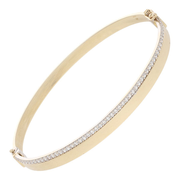 Pulsera de arillo articulada con circonias en oro dos tonos 14 kilates.
