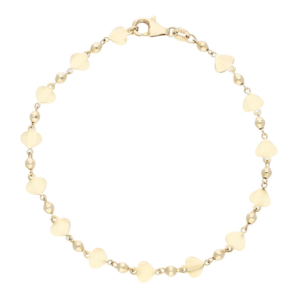 Pulsera eslabón laminado con aplicaciones motivo corazón en oro amarillo 14 kilates.