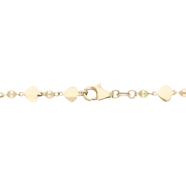 Pulsera eslabón laminado con aplicaciones motivo corazón en oro amarillo 14 kilates.