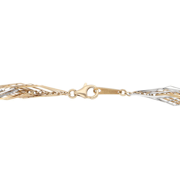 Pulsera eslabón tejido en oro dos tonos 14 kilates.