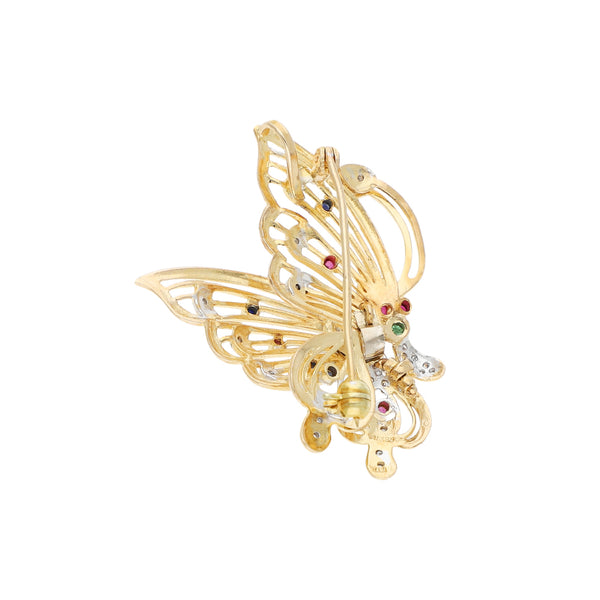 Prendedor calado motivo mariposa con diamantes y sintéticos en oro dos tonos 14 kilates.