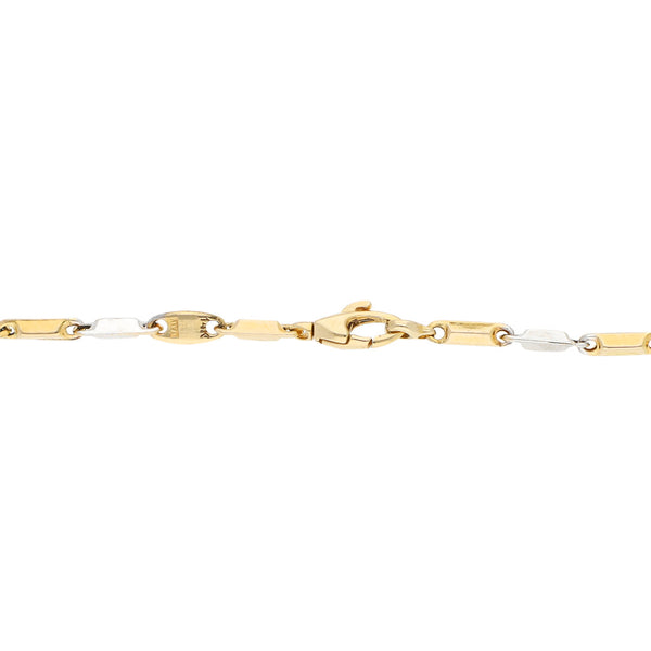 Pulsera eslabón cruzado en oro dos tonos 14 kilates.