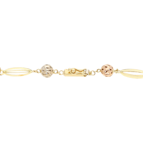 Pulsera eslabón articulado en oro tres tonos 14 kilates.