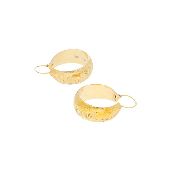 Arracadas labradas en oro amarillo 14 kilates.