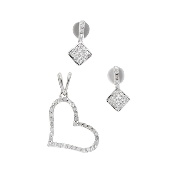 Juego de dije y aretes diseño especial motivo corazón con diamantes en oro blanco 14 kilates.