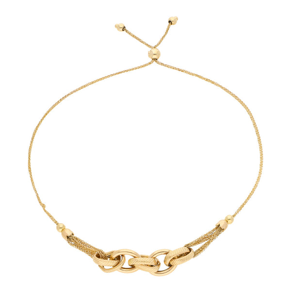 Pulsera eslabón tejido con aplicaciones en oro amarillo 14 kilates.