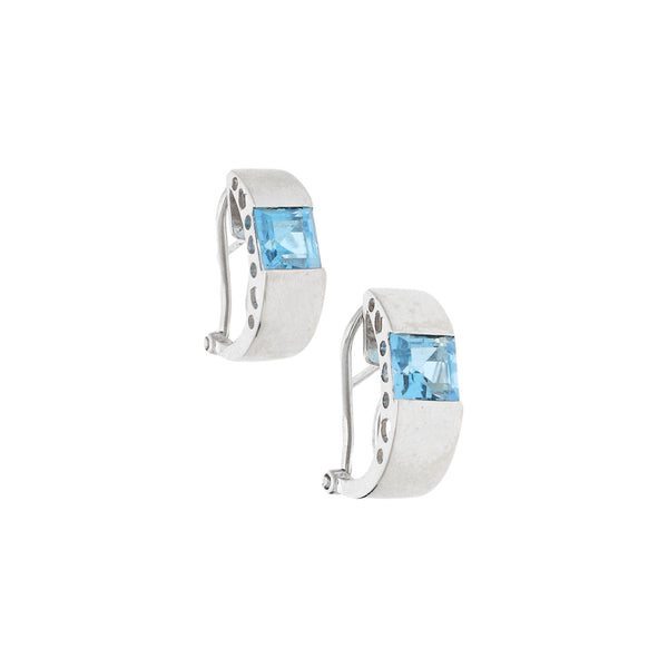 Aretes estilizados con sintéticos en oro blanco 14 kilates.
