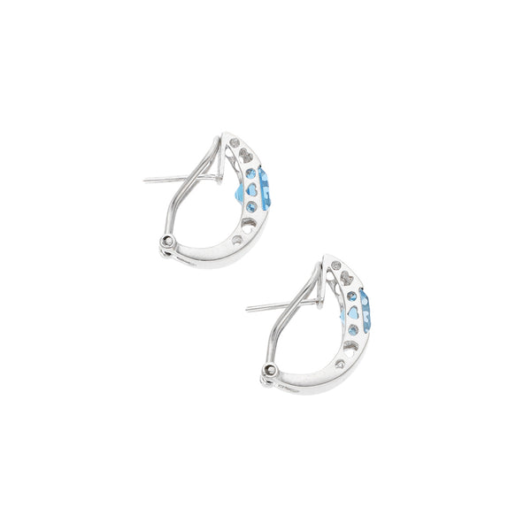 Aretes estilizados con sintéticos en oro blanco 14 kilates.