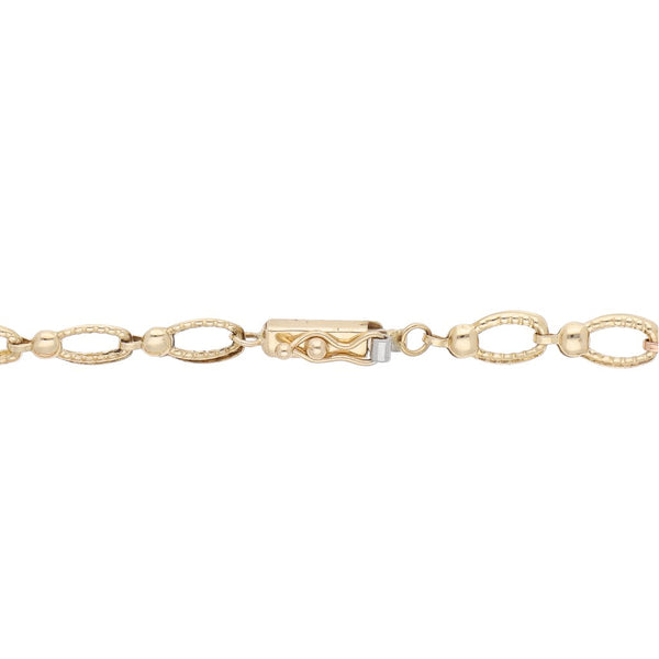 Pulsera eslabón articulado en oro tres tonos 14 kilates.