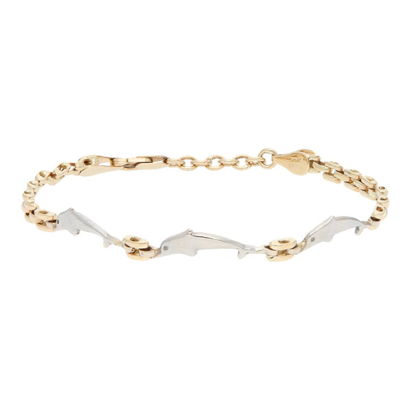 Pulsera eslabón articulado aplicación delfín en oro dos tonos 14 kilates.