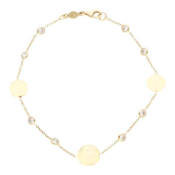 Pulsera eslabón cruzado con aplicaciones motivo círculos con sintéticos en oro amarillo 14 kilates.