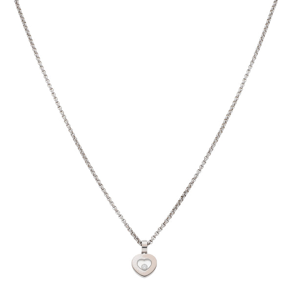 Gargantilla eslabón cruzado y dije diseño especial firma Chopard motivo corazón con diamante flotante en oro blanco 18 kilates.