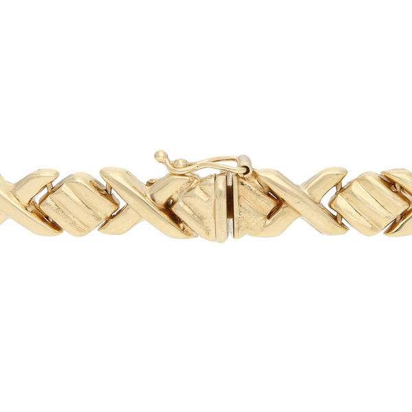 Pulsera eslabón XOXO en oro amarillo 14 kilates.
