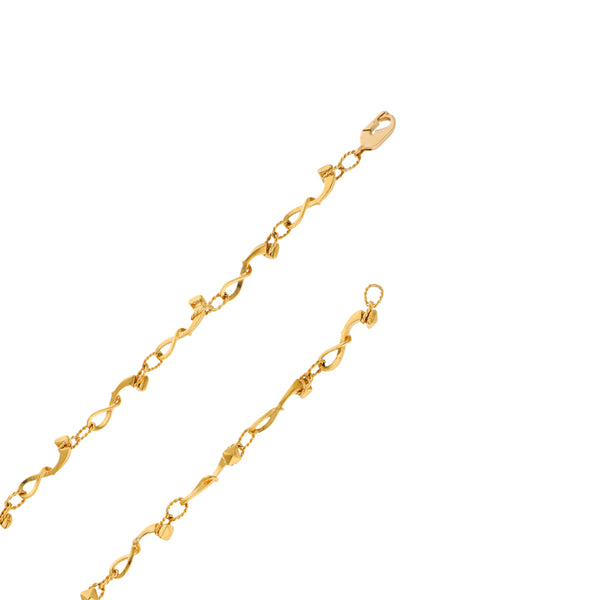 Collar eslabón combinado firma Carrera y Carrera con dije diseño especial con diamantes, esmeralda, rubí y zafiros motivo arlequín firma Chopard en oro amarillo 18 kilates.