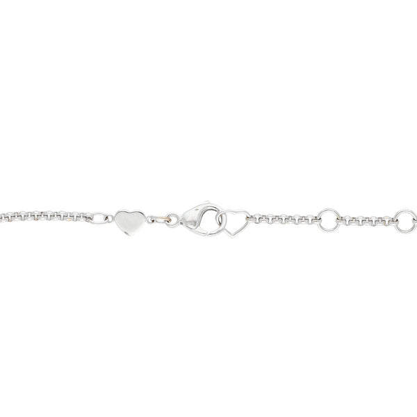 Pulsera eslabón cruzado firma Chopard con colgante motivo corazón con diamante flotante en oro blanco 18 kilates.
