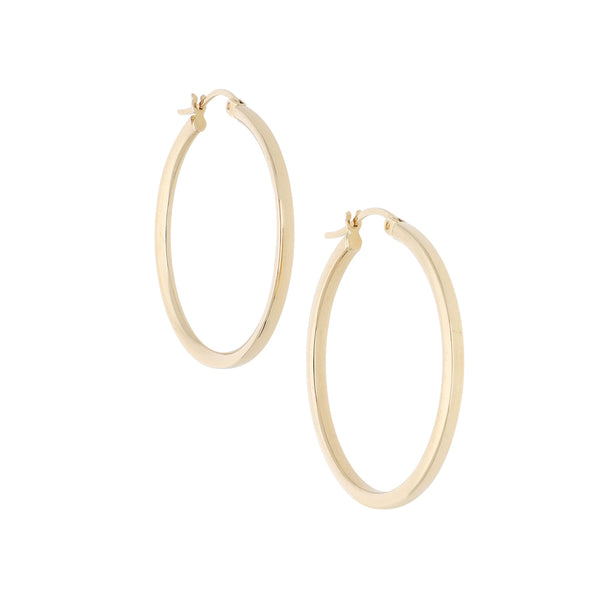 Arracadas lisas en oro amarillo 14 kilates.