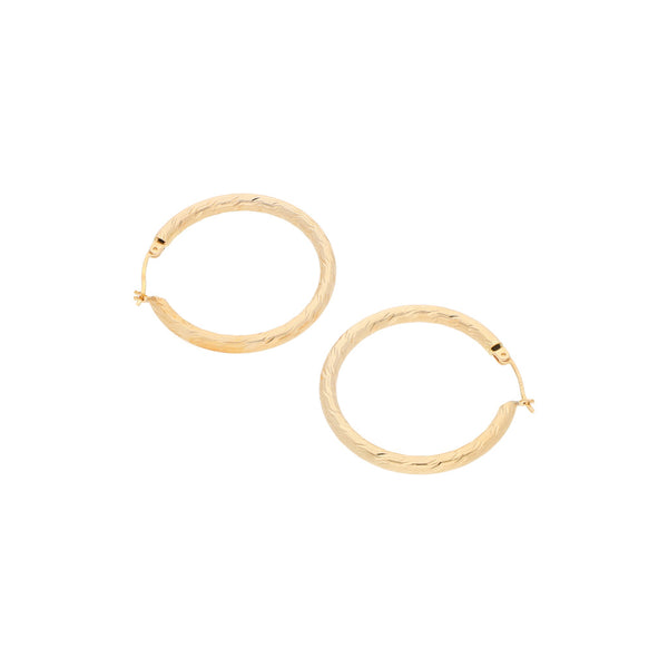 Arracadas huecas en oro amarillo 14 kilates.